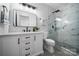 Bathroom featuring a glass enclosed shower with marble tile and a sleek vanity at 287 Mcdonald Ave, Charlotte, NC 28203