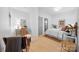 Bright bedroom featuring a bed with white bedding, a desk, and access to the bathroom at 287 Mcdonald Ave, Charlotte, NC 28203