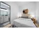 Bedroom with light neutral decor and open access to the modern bathroom at 287 Mcdonald Ave, Charlotte, NC 28203