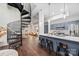 Open-concept living space with a spiral staircase, a modern kitchen, and seating at island at 287 Mcdonald Ave, Charlotte, NC 28203