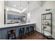 Contemporary kitchen featuring gray cabinetry, stainless steel appliances, and a breakfast bar with seating at 287 Mcdonald Ave, Charlotte, NC 28203