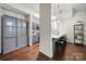 Open-concept kitchen with modern gray cabinetry, quartz countertops, and a breakfast bar with seating for four at 287 Mcdonald Ave, Charlotte, NC 28203