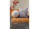 The photo displays a tan leather couch featuring a variety of decorative throw pillows at 287 Mcdonald Ave, Charlotte, NC 28203