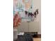 A sideboard is decorated with a vase of branches and contemporary art, adding charm to the interior at 287 Mcdonald Ave, Charlotte, NC 28203