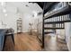 Living room with spiral staircase, hardwood floors, and modern decor at 287 Mcdonald Ave, Charlotte, NC 28203