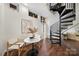 Living area featuring hardwood floors, spiral staircase, modern seating and a bright and airy space at 287 Mcdonald Ave, Charlotte, NC 28203