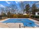 Backyard with a large, covered swimming pool, framed by trees, plants and surrounding landscaping at 3202 Grange Ct, Belmont, NC 28012