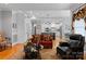 Comfortable living room with hardwood floors, a decorative rug, and an open view to the kitchen at 3202 Grange Ct, Belmont, NC 28012