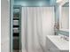 Bathroom featuring a built-in shelving unit next to the shower and a white vanity with mirror at 331 E White St, Rock Hill, SC 29730