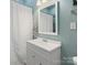 This bathroom features a white vanity, a mirror, and a shower with a white curtain at 331 E White St, Rock Hill, SC 29730