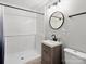 Modern bathroom featuring subway tile shower, neutral walls, and a wood vanity at 331 E White St, Rock Hill, SC 29730