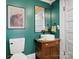 Bathroom with green walls, a decorative mirror, and a vanity with vessel sink at 331 E White St, Rock Hill, SC 29730