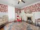 Charming Bedroom with decorative wallpaper, fireplace, and a cozy crib at 331 E White St, Rock Hill, SC 29730