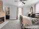 Bedroom featuring a brick fireplace, natural light, and decorative accents at 331 E White St, Rock Hill, SC 29730