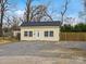 Detached garage with siding and a gravel driveway at 331 E White St, Rock Hill, SC 29730
