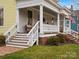 Inviting front porch with a chair, railing and stairs leading up to the porch at 331 E White St, Rock Hill, SC 29730