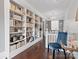 Hallway featuring custom built-in bookshelves and chandelier lighting at 331 E White St, Rock Hill, SC 29730