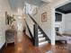 Elegant hallway with decorative wallpaper, hardwood floors, and a staircase leading upstairs at 331 E White St, Rock Hill, SC 29730