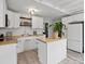 Well-lit kitchen featuring white cabinets, butcher block countertops, and an island at 331 E White St, Rock Hill, SC 29730
