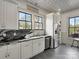 Modern kitchen with white cabinets, stainless steel appliances, and elegant countertops at 331 E White St, Rock Hill, SC 29730