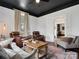 Inviting living room with leather recliners, a decorative rug, and lots of natural light at 331 E White St, Rock Hill, SC 29730