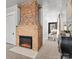 Inviting living room featuring a brick fireplace and view into a sitting room at 331 E White St, Rock Hill, SC 29730