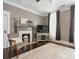 Living room features a decorative fireplace, neutral walls, and hardwood floors at 331 E White St, Rock Hill, SC 29730