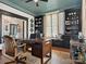 This office features custom built-ins, stylish decor, and a unique painted floor design at 331 E White St, Rock Hill, SC 29730