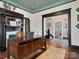 The home office is well-lit with a large desk, fireplace, and classic decor at 331 E White St, Rock Hill, SC 29730