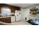 Functional kitchen area with wood cabinets, a window, and essential appliances at 3331 Tamworth Ln, Gastonia, NC 28052