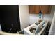 A functional laundry room featuring a modern washing machine and ample cabinet storage for convenience at 3331 Tamworth Ln, Gastonia, NC 28052