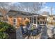 Charming backyard with brick home, spacious patio and a screened-in porch at 4001 Glenfall Ave, Charlotte, NC 28210