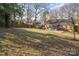 Expansive backyard with patio, screened-in porch and plenty of space to enjoy at 4001 Glenfall Ave, Charlotte, NC 28210