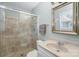 Bathroom with a glass shower, sink, toilet and large mirror with vanity at 4001 Glenfall Ave, Charlotte, NC 28210