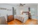 Charming bedroom featuring hardwood floors, natural light, and a ceiling fan at 4001 Glenfall Ave, Charlotte, NC 28210