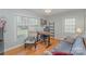 Inviting home office featuring wood floors, natural light, and comfortable seating at 4001 Glenfall Ave, Charlotte, NC 28210