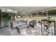 Cozy screened-in porch offers comfortable seating and bar with view of outdoors at 4001 Glenfall Ave, Charlotte, NC 28210