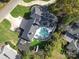 Aerial view showcasing home, pool, and landscaping at 4129 Carnoustie Ln, Charlotte, NC 28210