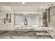 Bathroom with soaking tub, glass shower, and marble flooring at 4129 Carnoustie Ln, Charlotte, NC 28210