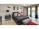 Stylish bedroom with a sleek black bed and private access to outdoor patio at 4129 Carnoustie Ln, Charlotte, NC 28210
