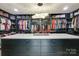 Spacious walk-in closet with custom shelving and island at 4129 Carnoustie Ln, Charlotte, NC 28210