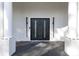 Elegant double front doors with modern hardware and lighting at 4129 Carnoustie Ln, Charlotte, NC 28210