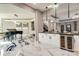 Modern kitchen with wine cooler and breakfast bar at 4129 Carnoustie Ln, Charlotte, NC 28210