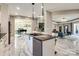 Open concept kitchen with marble floors and island seating at 4129 Carnoustie Ln, Charlotte, NC 28210