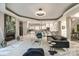 Spacious living area with an open floor plan, modern fireplace, and kitchen views at 4129 Carnoustie Ln, Charlotte, NC 28210