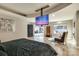Luxurious main bedroom with large TV and backyard views at 4129 Carnoustie Ln, Charlotte, NC 28210