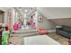 Fun playroom with built-in shelves and a comfy sitting area, perfect for imaginative play at 4129 Carnoustie Ln, Charlotte, NC 28210