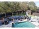 Luxury backyard oasis featuring a pool, playground, and patio at 4129 Carnoustie Ln, Charlotte, NC 28210