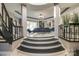 Modern staircase with metal railings leading to open living area at 4129 Carnoustie Ln, Charlotte, NC 28210