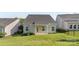 Backyard view with lawn, black metal fence and covered porch at 4866 Breden St, Kannapolis, NC 28081